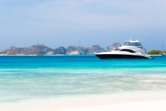 Luxury-Yacht-on-the-beach-scaled